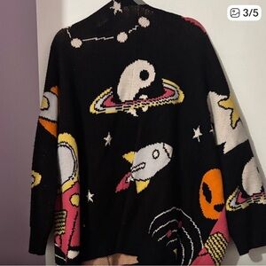 Dressed in LaLa Black Cosmic Cardigan with Rocket Design